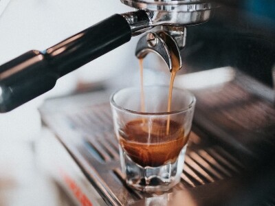 Coffee machine making espresso on a glass