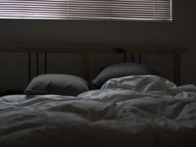 dim empty bedroom after a person wakes up