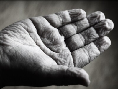 old persons hand in black and white filter